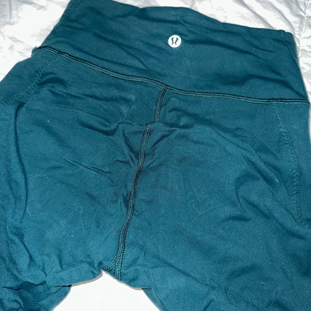 Lululemon Leggings Forrest Green color size 4 with leg detail, 28”